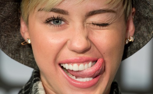 Miley Cyrus winks during an interview